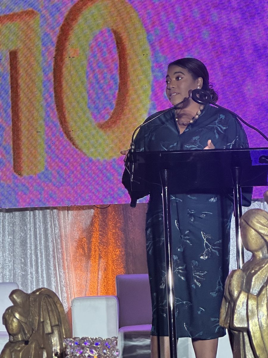 Jas speaking on stage